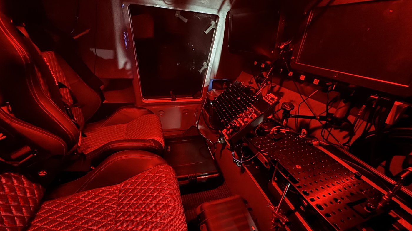 Red-lit blackout interior of the dark room