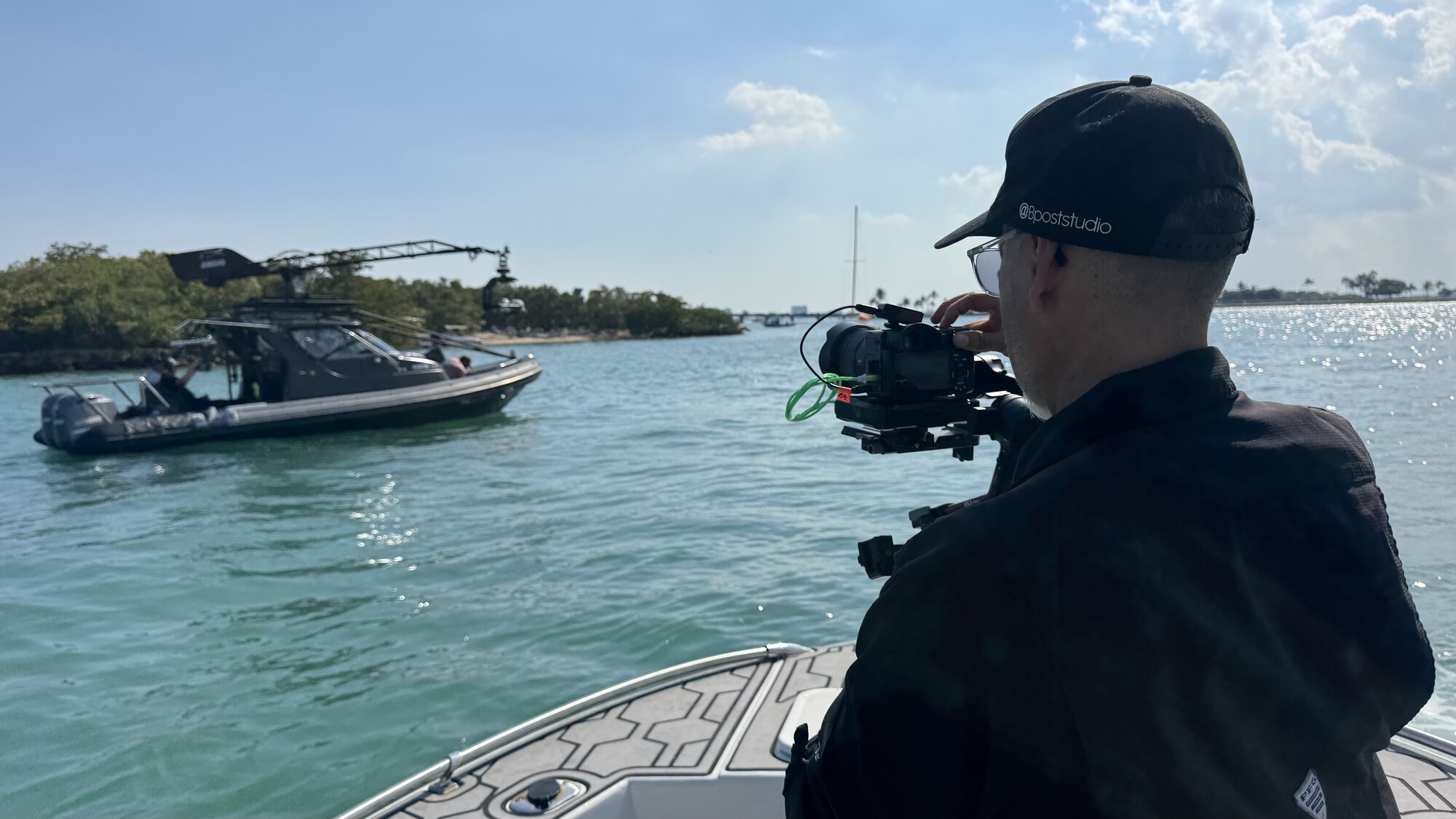 Operator on chase boat filming the Basilisk underway in Biscayne Bay