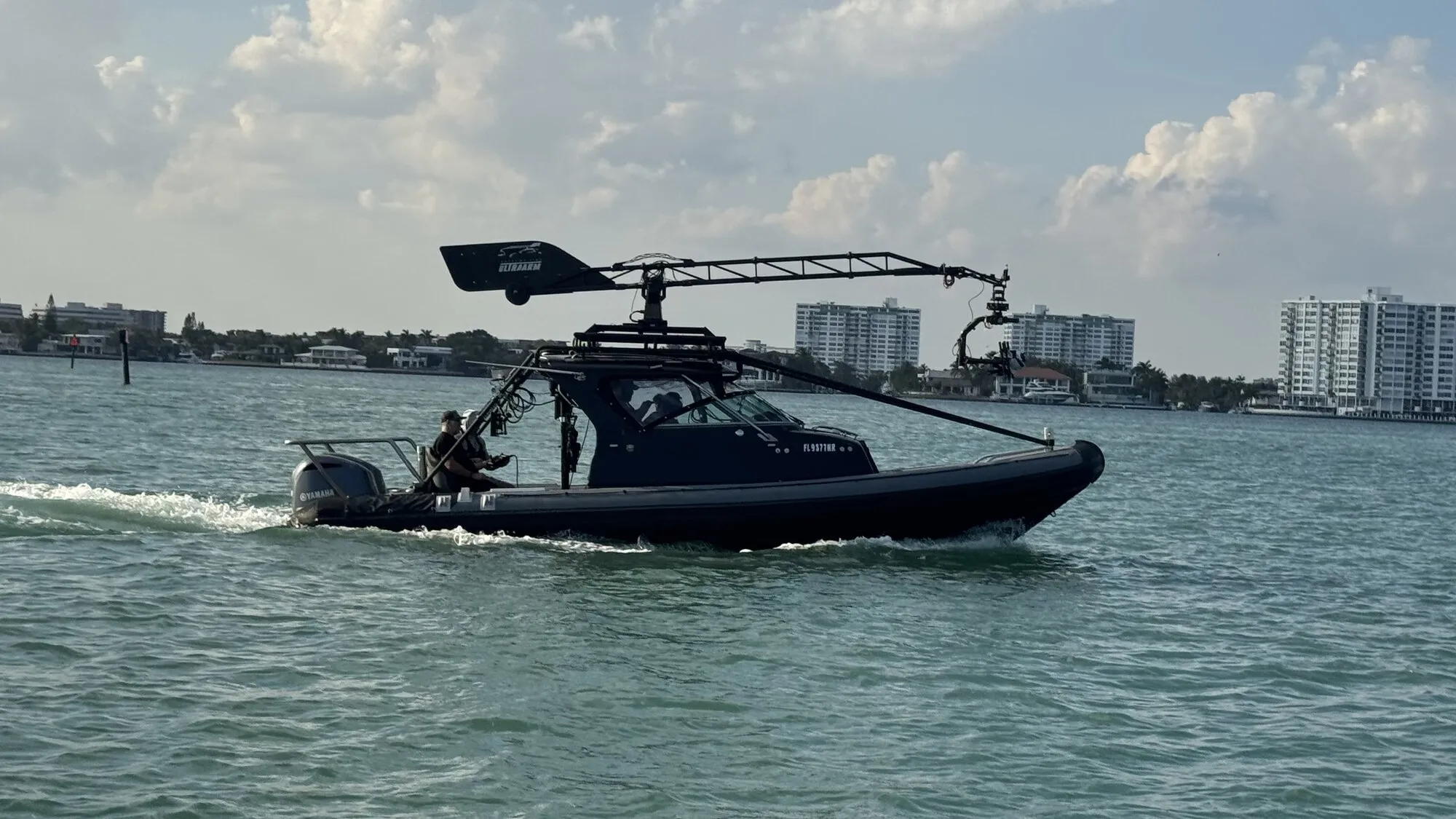 Clean broadside of the Basilisk crossing Miami waterways