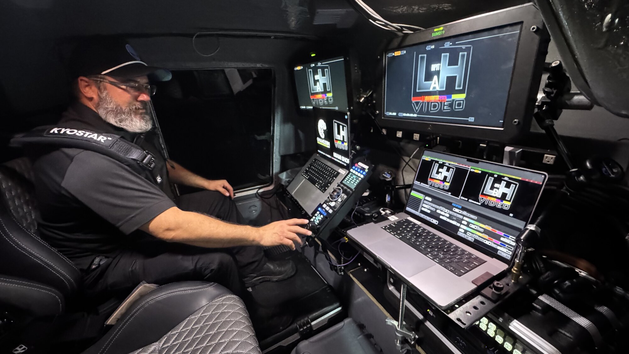 Operator at the LH Video console with monitors lit